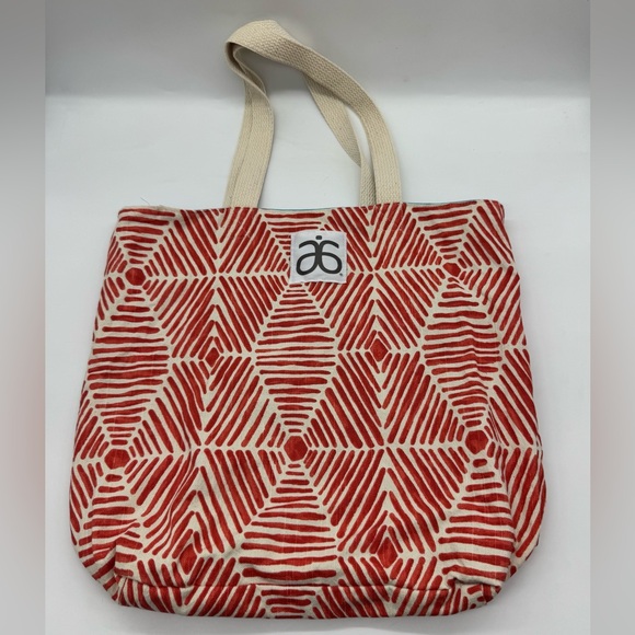 Arbonne Handbags - Arbonne Brand Tote Bag featuring geometric red and white pattern.